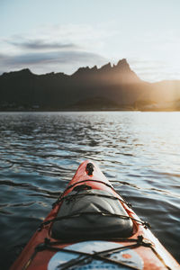 Boat in lake against mountains