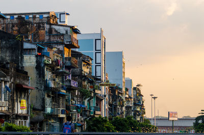 Buildings in residential district against sky