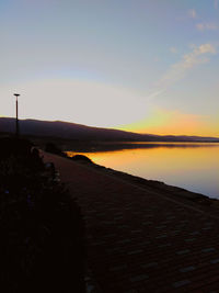 Scenic view of sea against clear sky during sunset