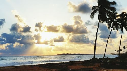 Scenic view of sea against cloudy sky