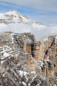 Scenic view of dolomites mountains during winter against sky