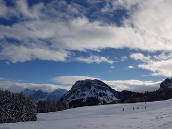 Scenic view of landscape against sky during winter