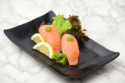 High angle view of fish in plate on table