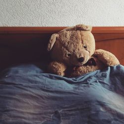 Close-up of stuffed toy on bed at home