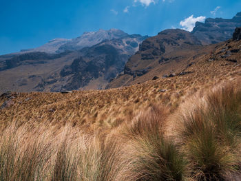 Scenic view of landscape and mountains against sky