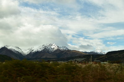 Scenic view of snowcapped mountains against sky