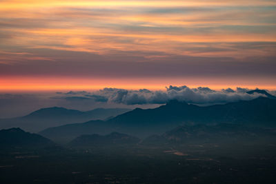 Scenic view of mountains against sky during sunset