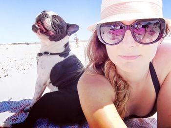 Dog and woman on beach