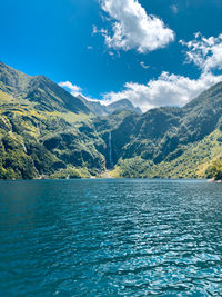 Scenic view of lake and mountains against sky