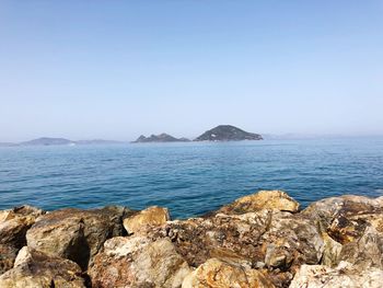 Scenic view of sea against clear sky