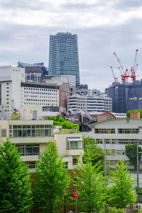 Buildings in city against sky