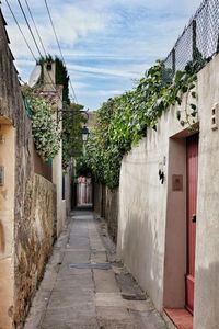 Narrow alley with buildings in background