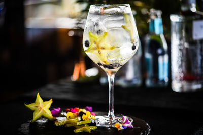 Tonic gin beverage with fresh fruits and spices