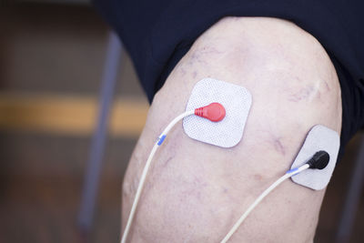 Cropped image of patient with medical equipment in hospital