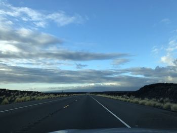 Empty road against sky