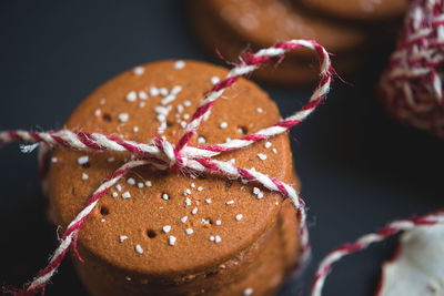 Close-up of cookies tied with string