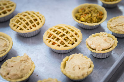 High angle view of tartlets in baking sheet