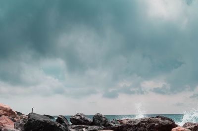 Panoramic view of sea and rocks against sky
