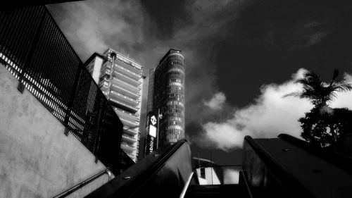 Low angle view of building against cloudy sky