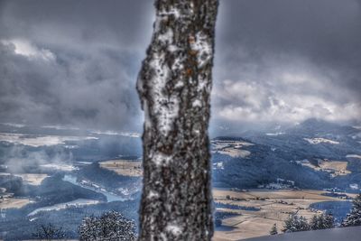 Scenic view of landscape against sky during winter