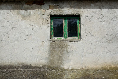 Low angle view of window on wall