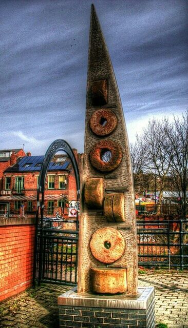 building exterior, built structure, architecture, sky, religion, spirituality, place of worship, art and craft, art, tree, outdoors, creativity, day, human representation, sculpture, no people, low angle view, cloud - sky