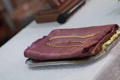 Close-up of purse on table