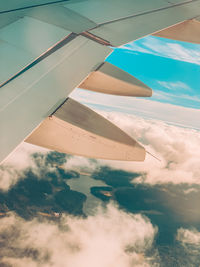 Aerial view of airplane flying in sky