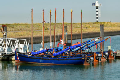 Boats in port against sky