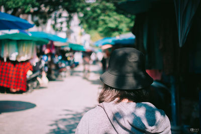 Rear view of woman on street in city