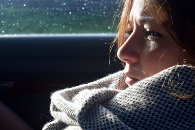 Close-up of young woman in winter