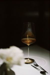 Close-up of wineglass on table