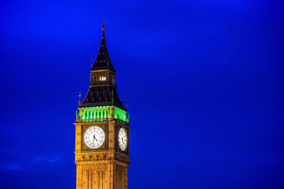 Low angle view of clock tower against sky