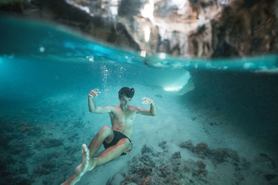 Full length of man swimming underwater