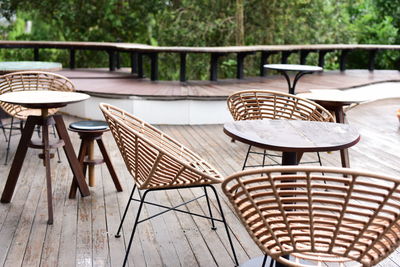 Empty chairs and tables in yard