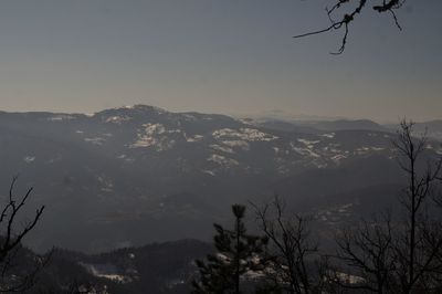 Scenic view of mountains against sky at sunset