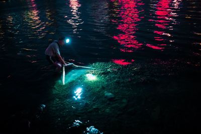 High angle view of person swimming in lake