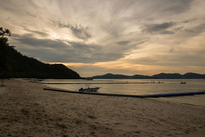 Scenic view of beach against sky during sunset