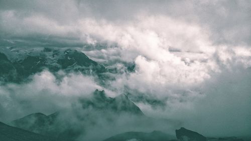 Aerial view of majestic mountains against sky