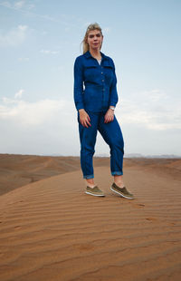 Full length of man on sand dune