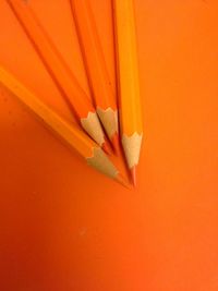 Close-up of orange colored pencils