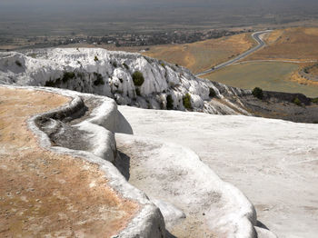 Scenic view of rock formations on landscape at pamukkale