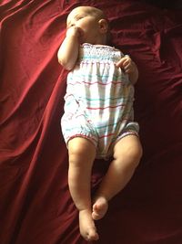 Baby girl sleeping on bed