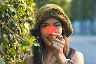 Portrait of young woman wearing hat