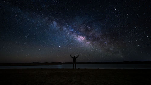 Scenic view of silhouette star field against sky at night