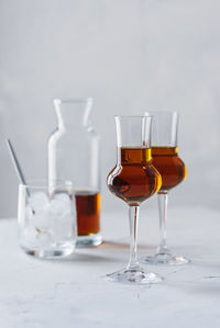 Close-up of wine glasses on table