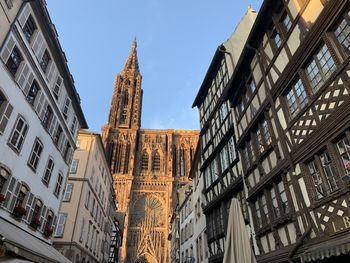 Low angle view of buildings against sky in city