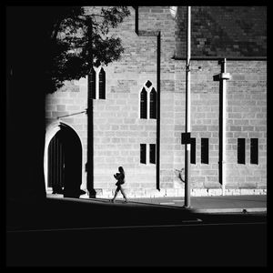 Full length of woman standing on railing