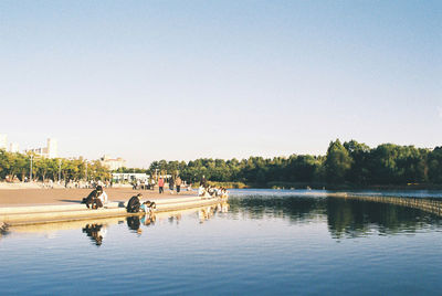 Scenic view of calm lake against clear sky