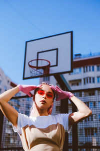 Low section of woman against sky